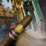 Cigar with a label held in front of a painting of 'The Cigar Room'. El Rey del Mundo W.I.H. 20 Years Regional Edition Lebanon 