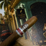 Cigar with a brand logo in front of a vintage 'Cigar Room' sign. Sancho Panza Quijote Regional Edition Spain